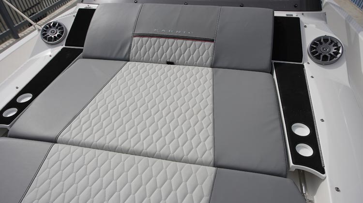 Fully cushioned sunbed at bow convertible to two-position inclined seat